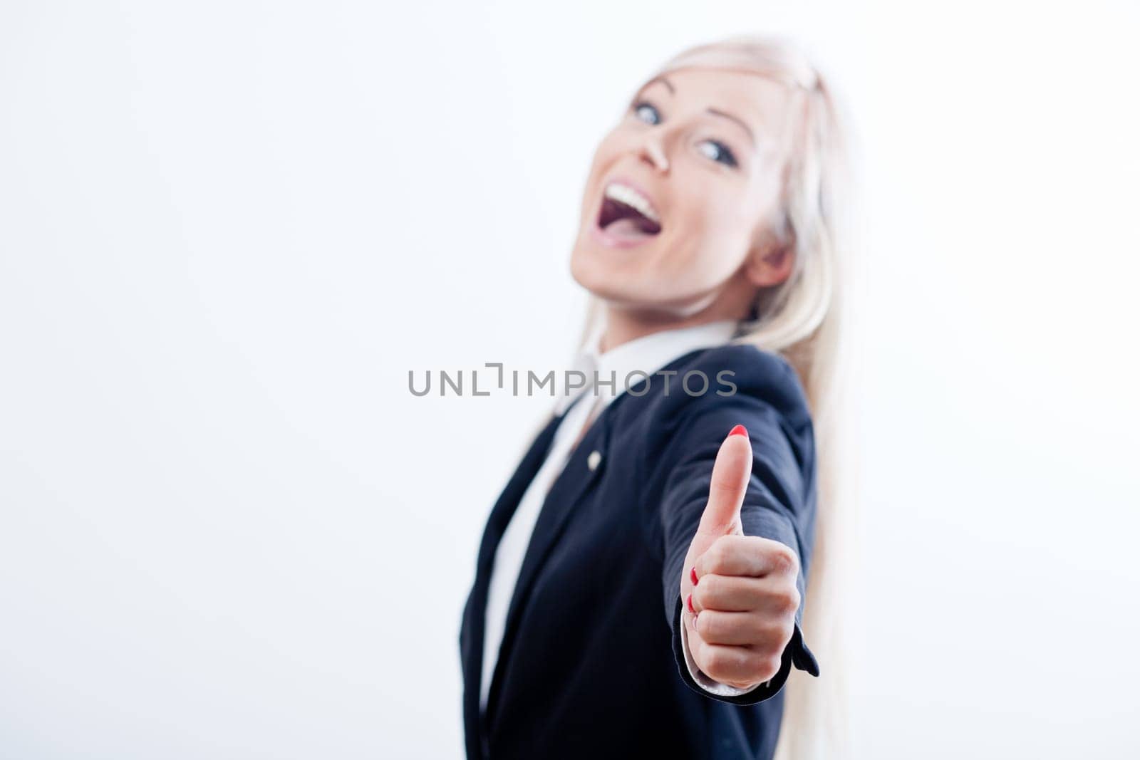 thumbs up succesful woman and smile with a blue jacket