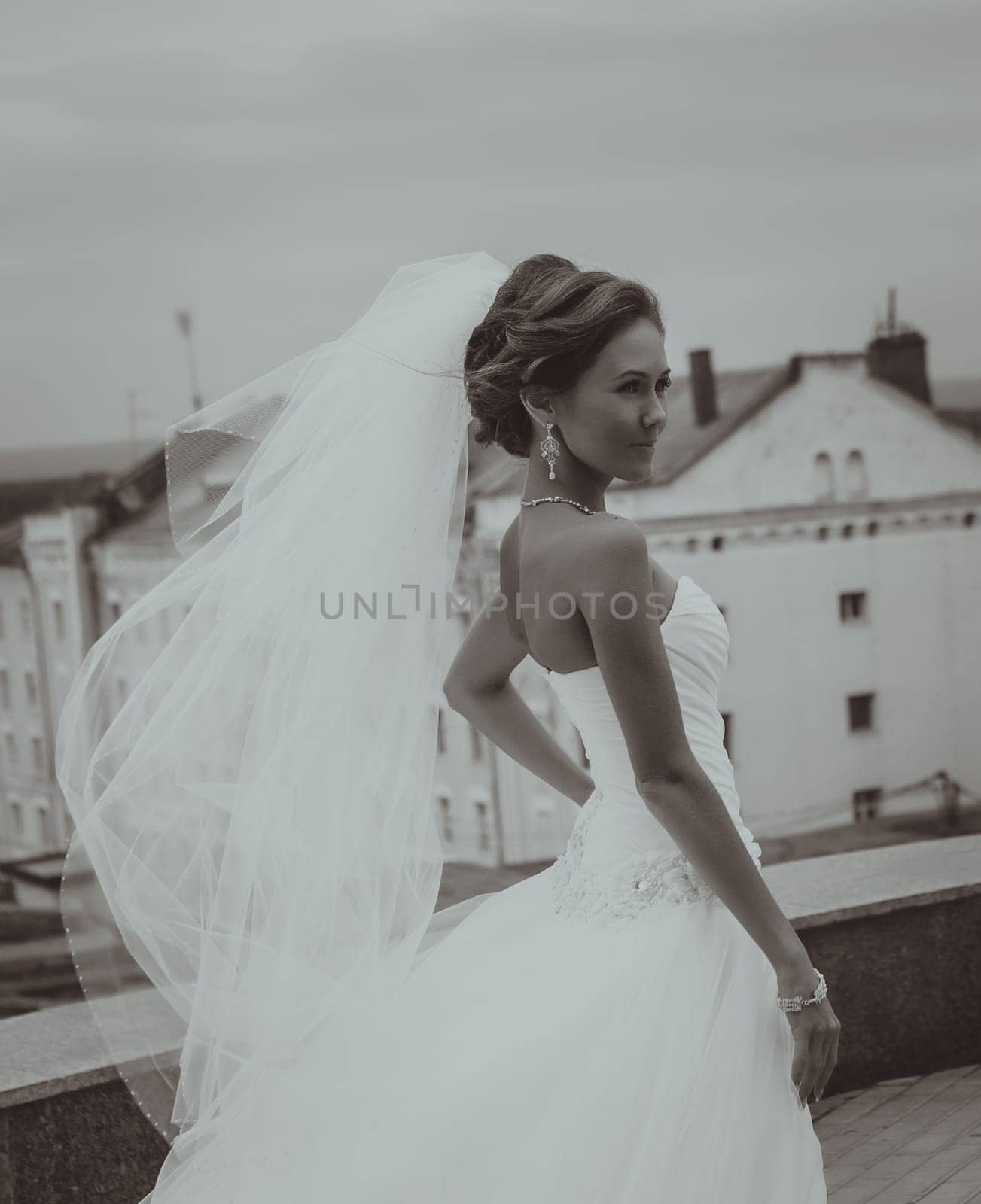outdoors portrait of young beautiful bride in city streets
