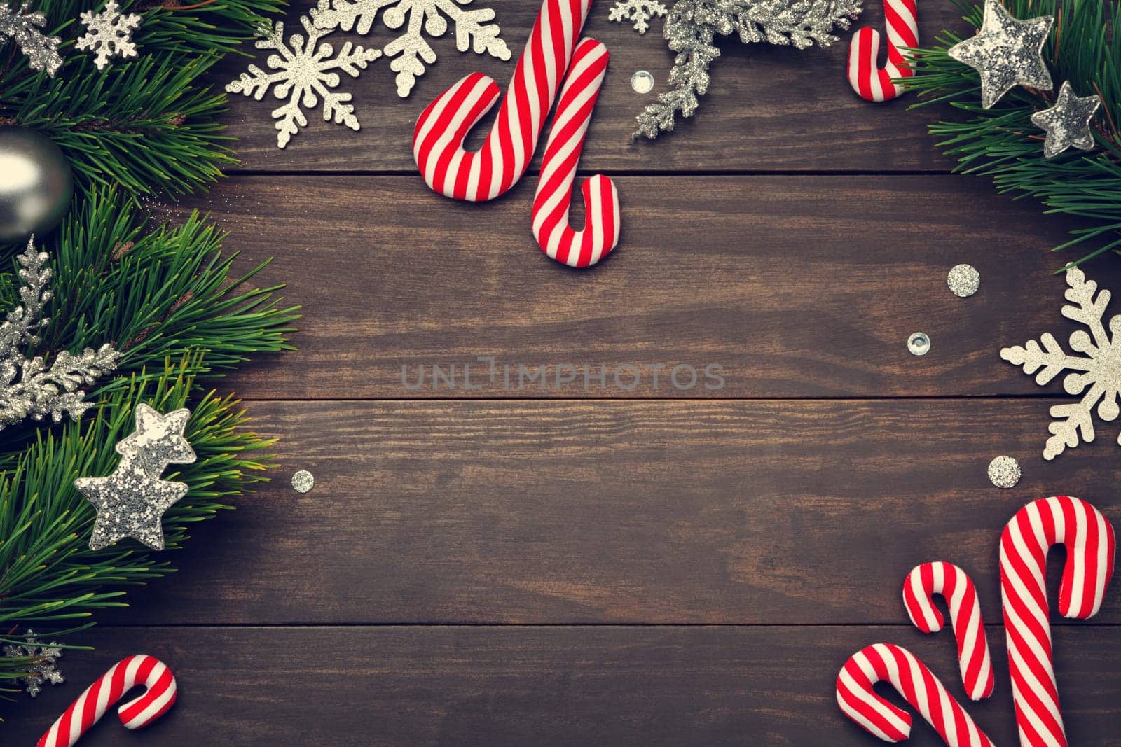 Christmas background with decorations on wooden table. Copy space. Top view