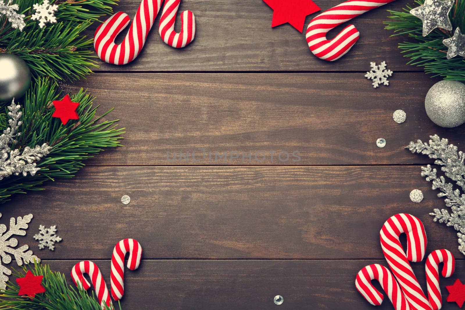 Christmas background with decorations on wooden table. Copy space. Top view
