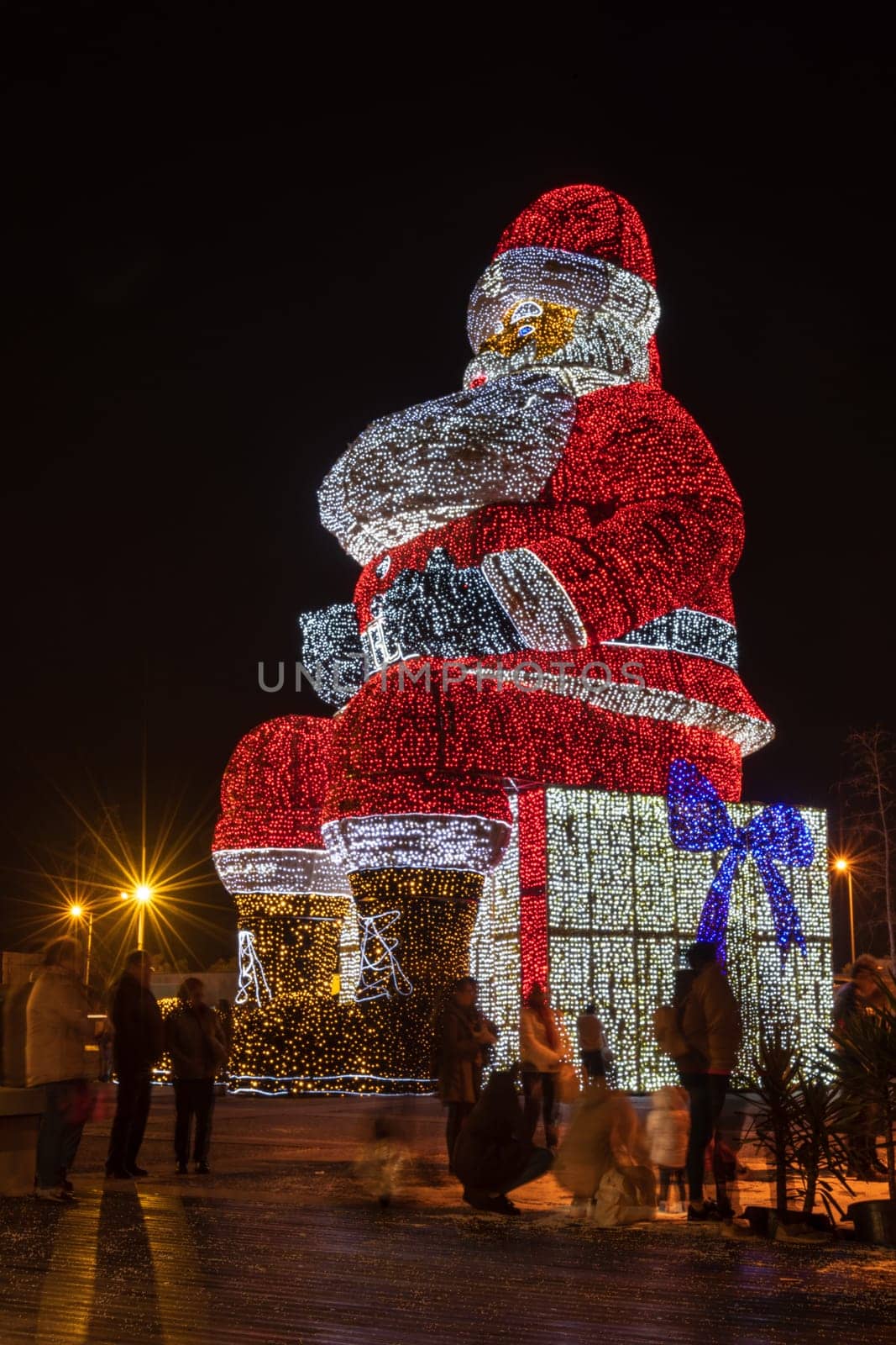 AGUEDA, PORTUGAL - CIRCA DECEMBER 2018: Worlds biggest Santa Claus with 21 meters hight, iluminated by 250. 000 Christmas lights.