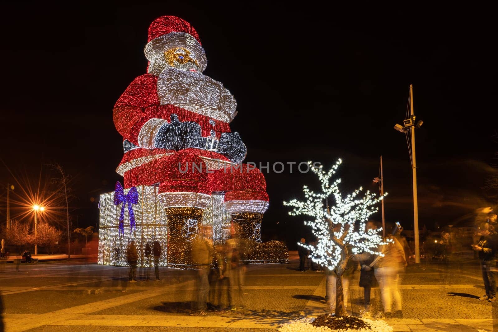 AGUEDA, PORTUGAL - CIRCA DECEMBER 2018: Worlds biggest Santa Claus with 21 meters hight, iluminated by 250. 000 Christmas lights.