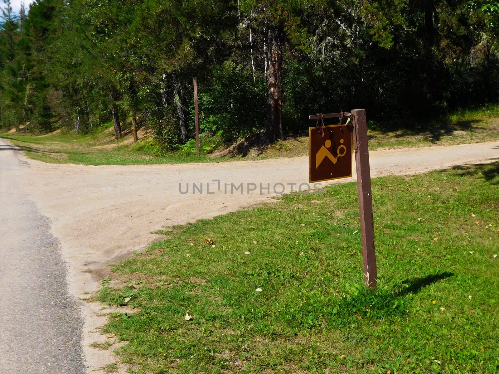 Sign to Indicate Tennis Courts Down Side Road.