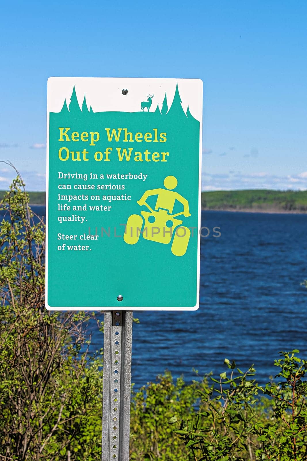Keep wheels out of water sign along a lakeshore.