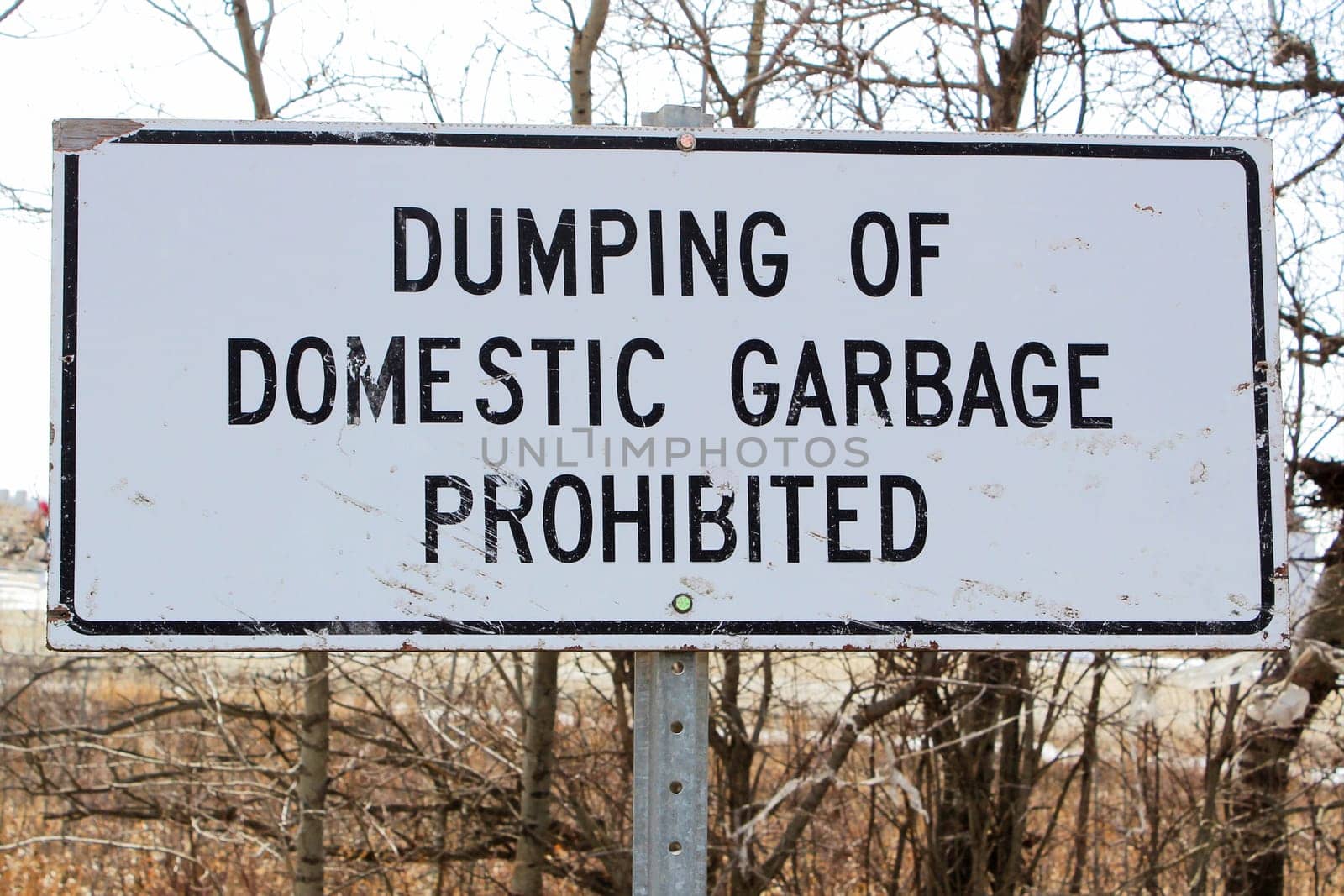 Dumping of domestic garbage prohibited sign.