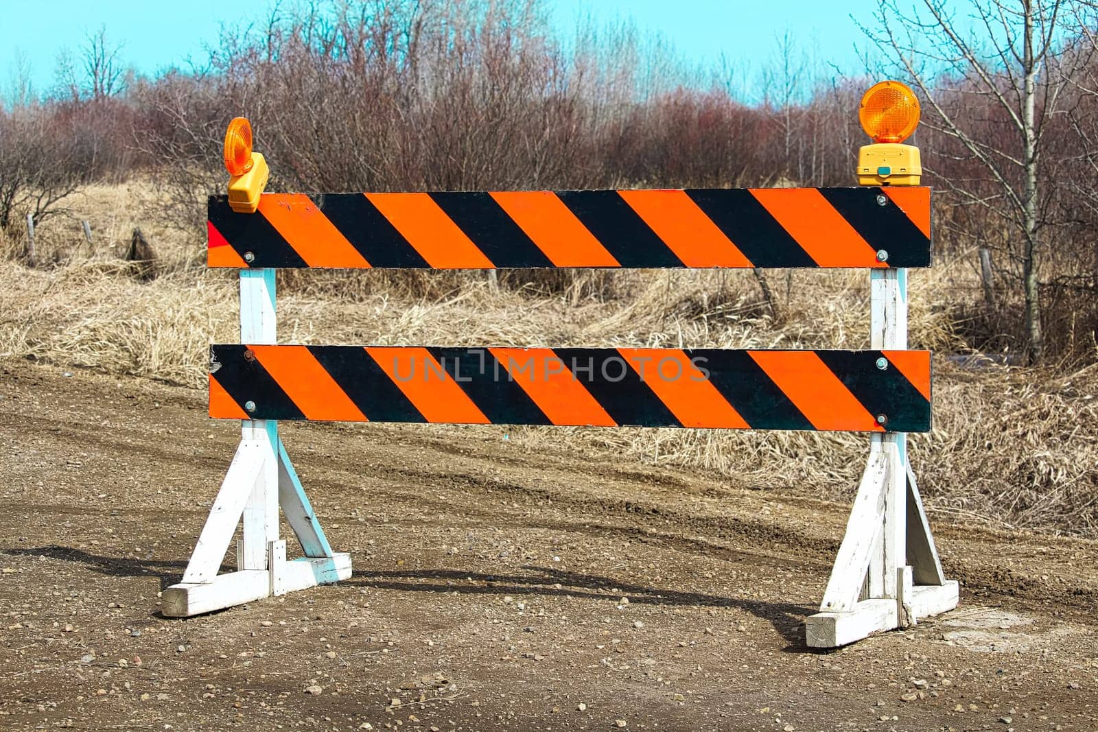 Construction barricade along a country road.