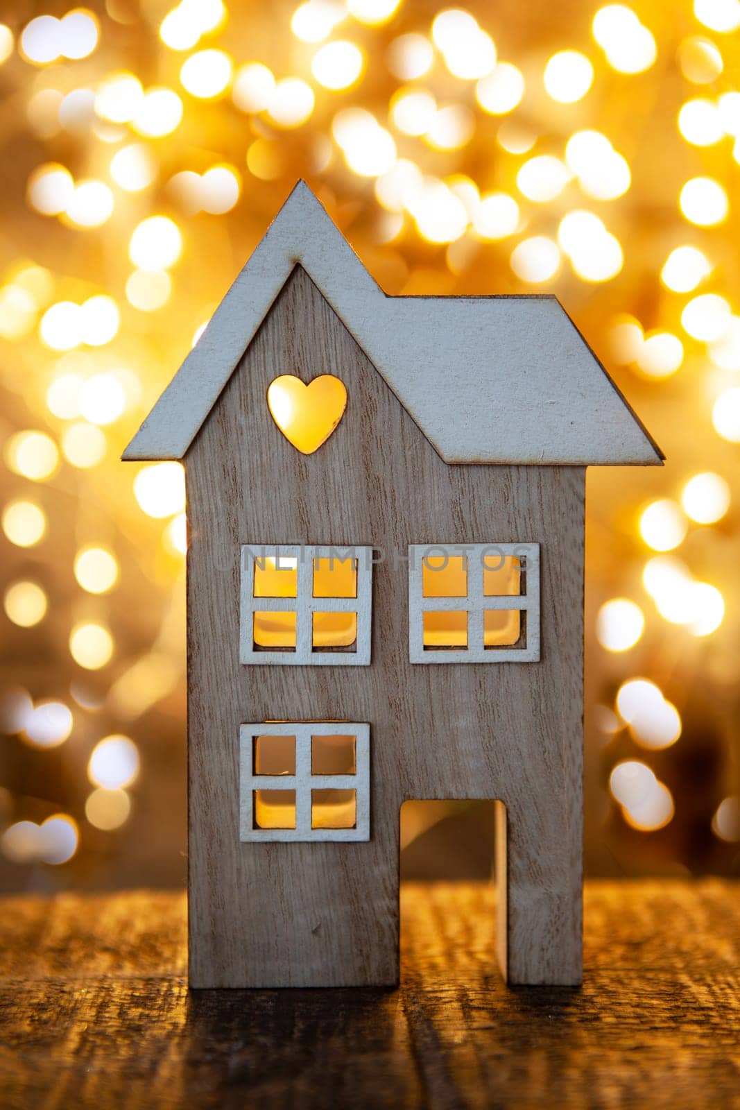 Cute little house in front of cozy lights