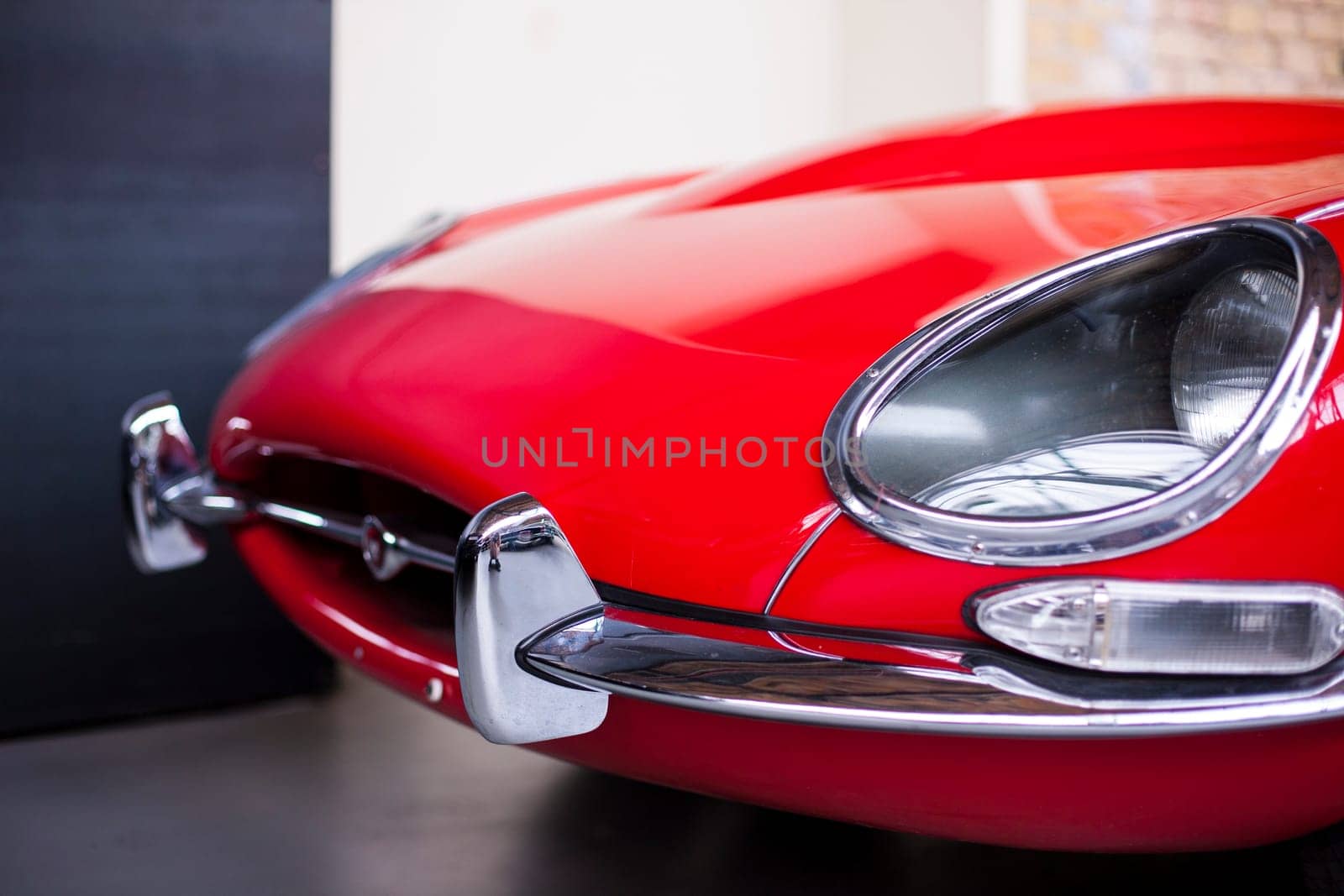 Classic vintage car. Close-up of headlights of luxurious vintage vehicle