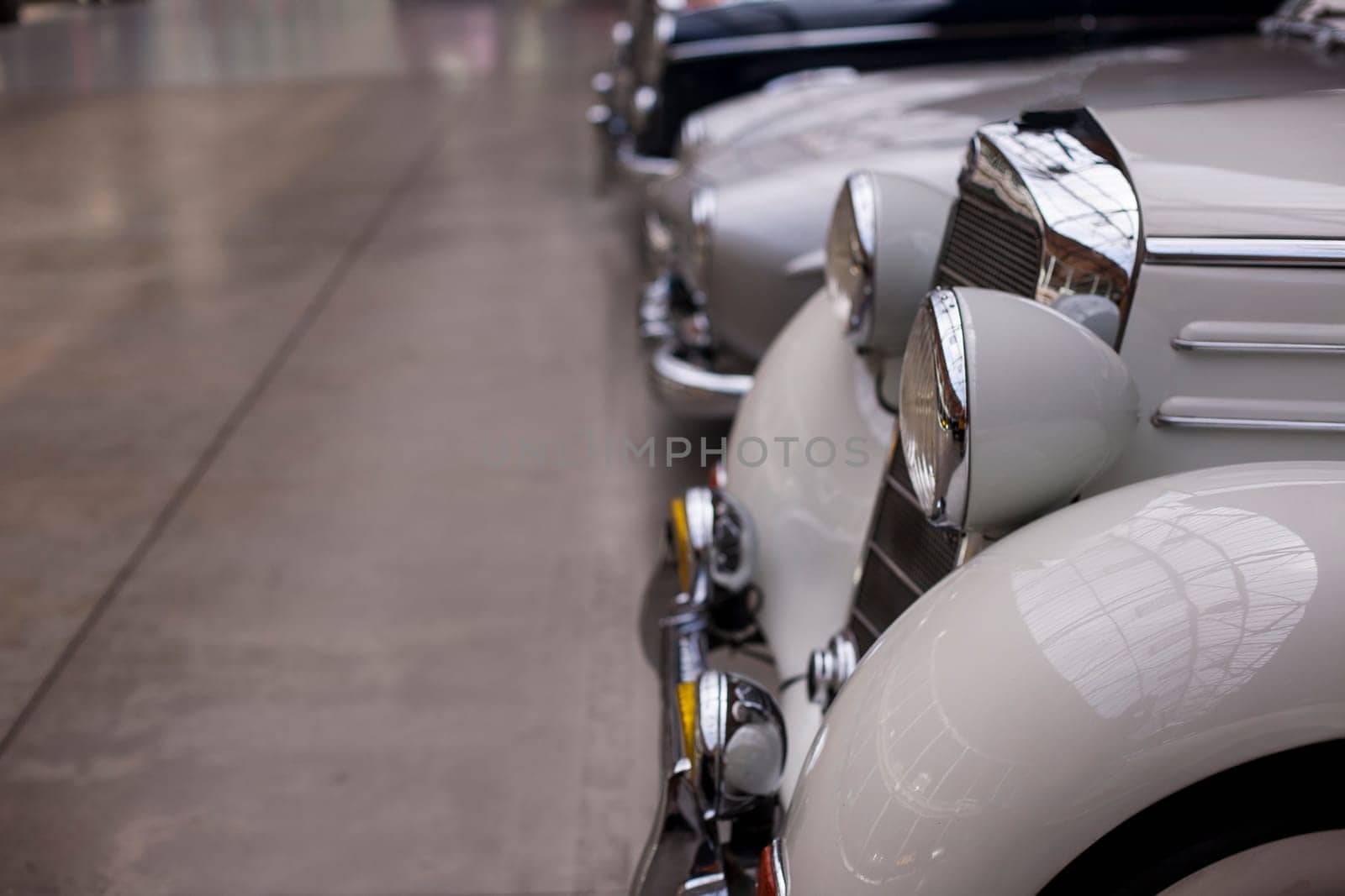 Classic vintage car. Close-up of headlights of luxurious vintage vehicle