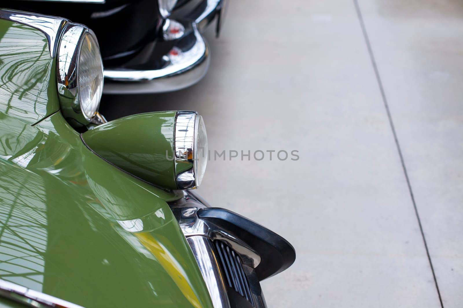 Classic vintage car. Close-up of headlights of luxurious vintage vehicle