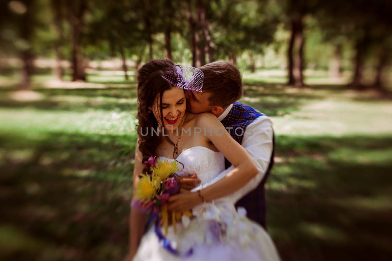 Married Couple in forest embracing