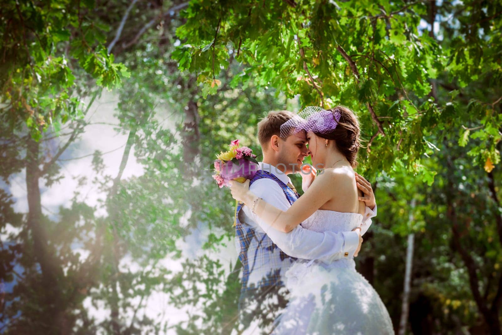 Married Couple in forest embracing