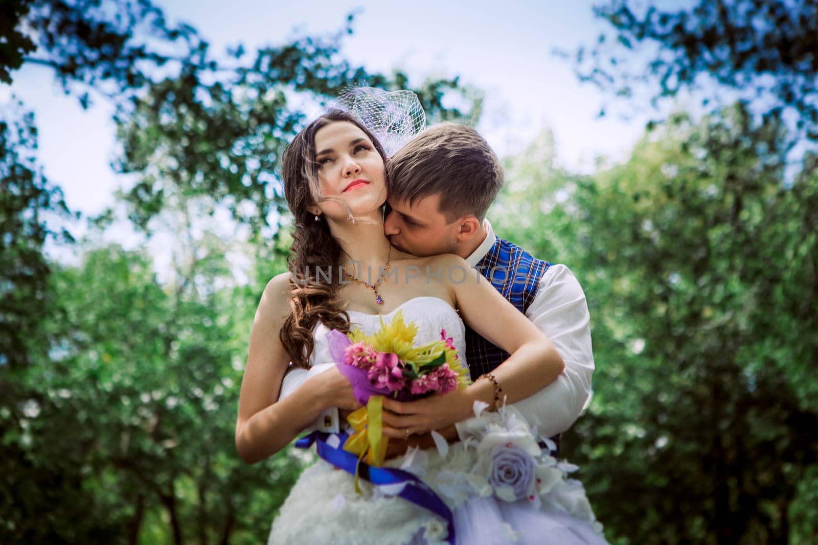 Married Couple in forest embracing