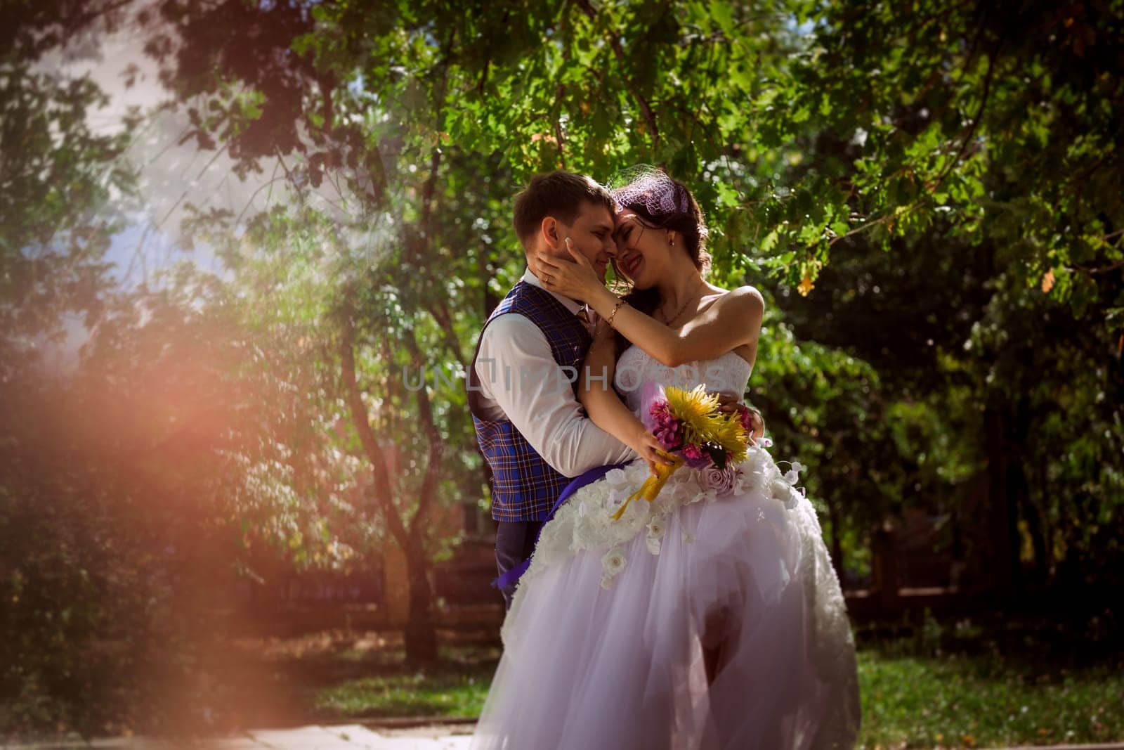 Married Couple in forest embracing