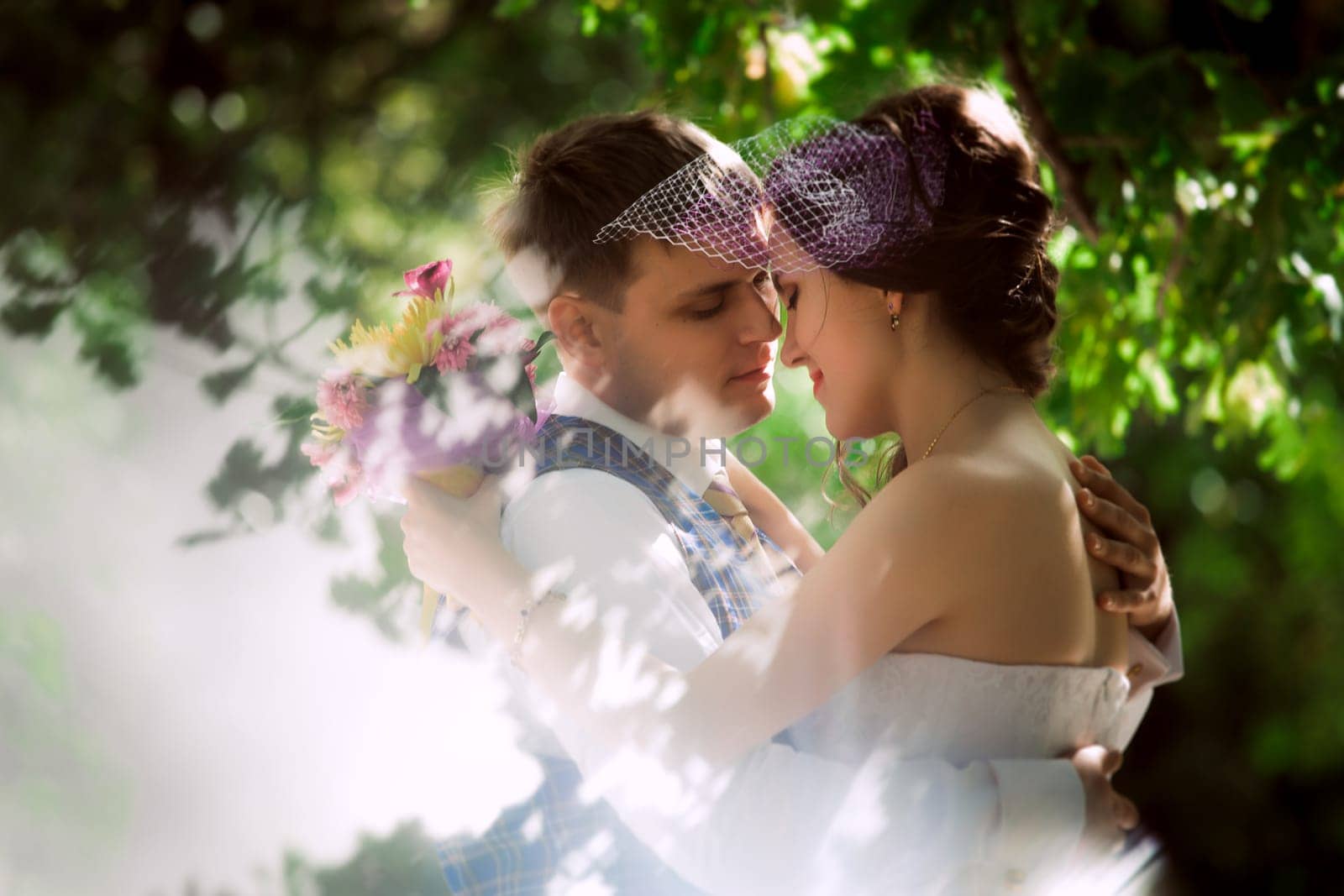 Married Couple in forest embracing