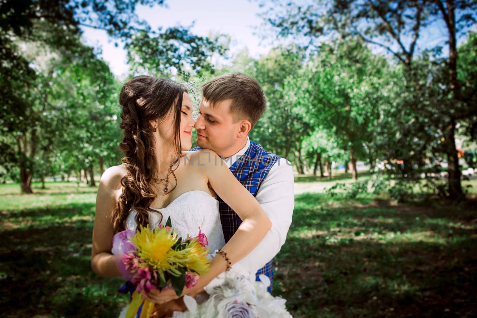 Married Couple in forest embracing