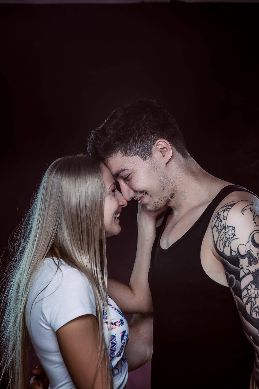 Sexy passion couple, beautiful young man and woman closeup, studio shot