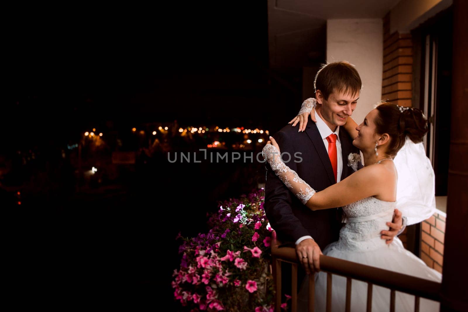 groom and bride at night