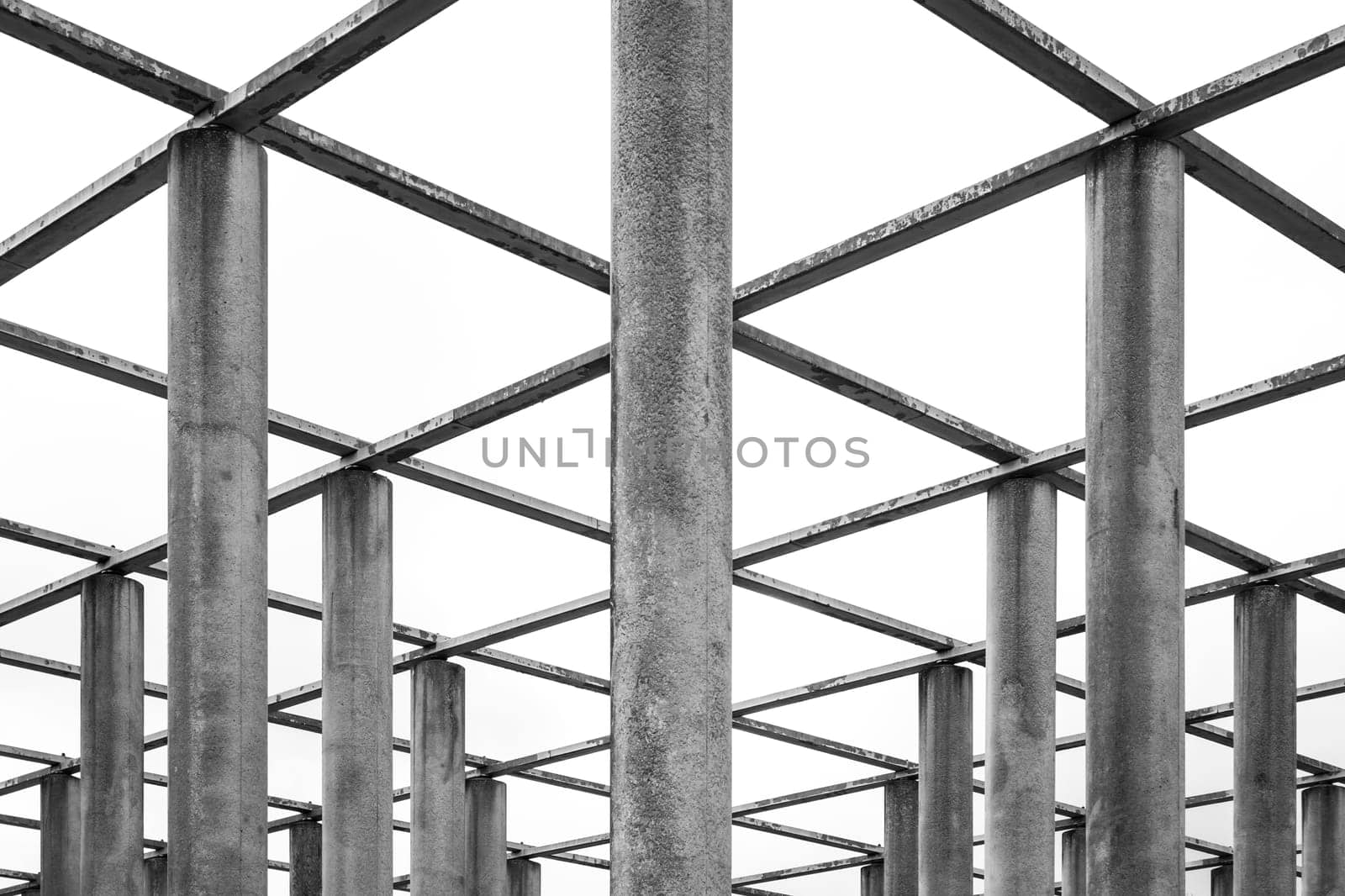 Cement Columns Chair Rough Texture Perspective Overhead Grid Geometric Pattern Design Outdoor Park Public Upright Minimal Bright Stone