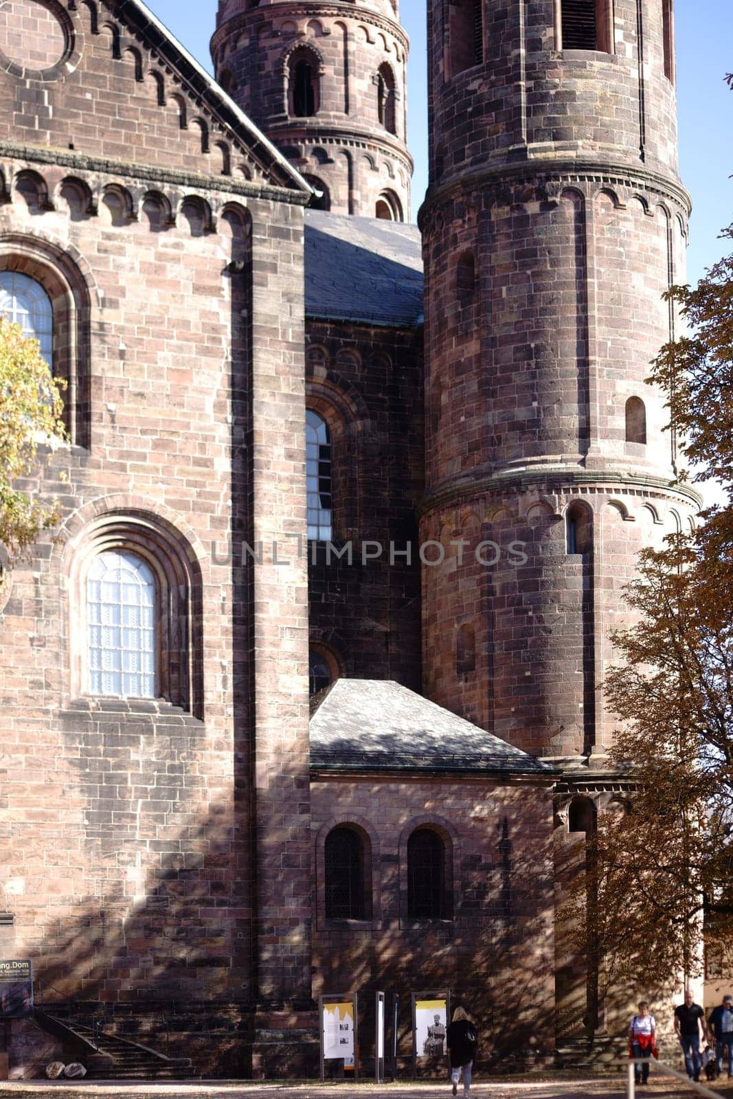 Worms, Germany - October 13, 2018: Visitors and tourists stand in front of the entrance of St. Peter's Cathedral on October 13, 2018 in Worms..