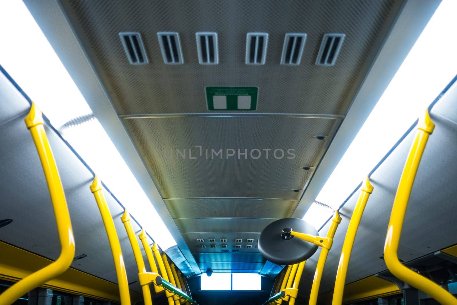 Public Transportation Bus Interior Yellow Poles White Fluorescent