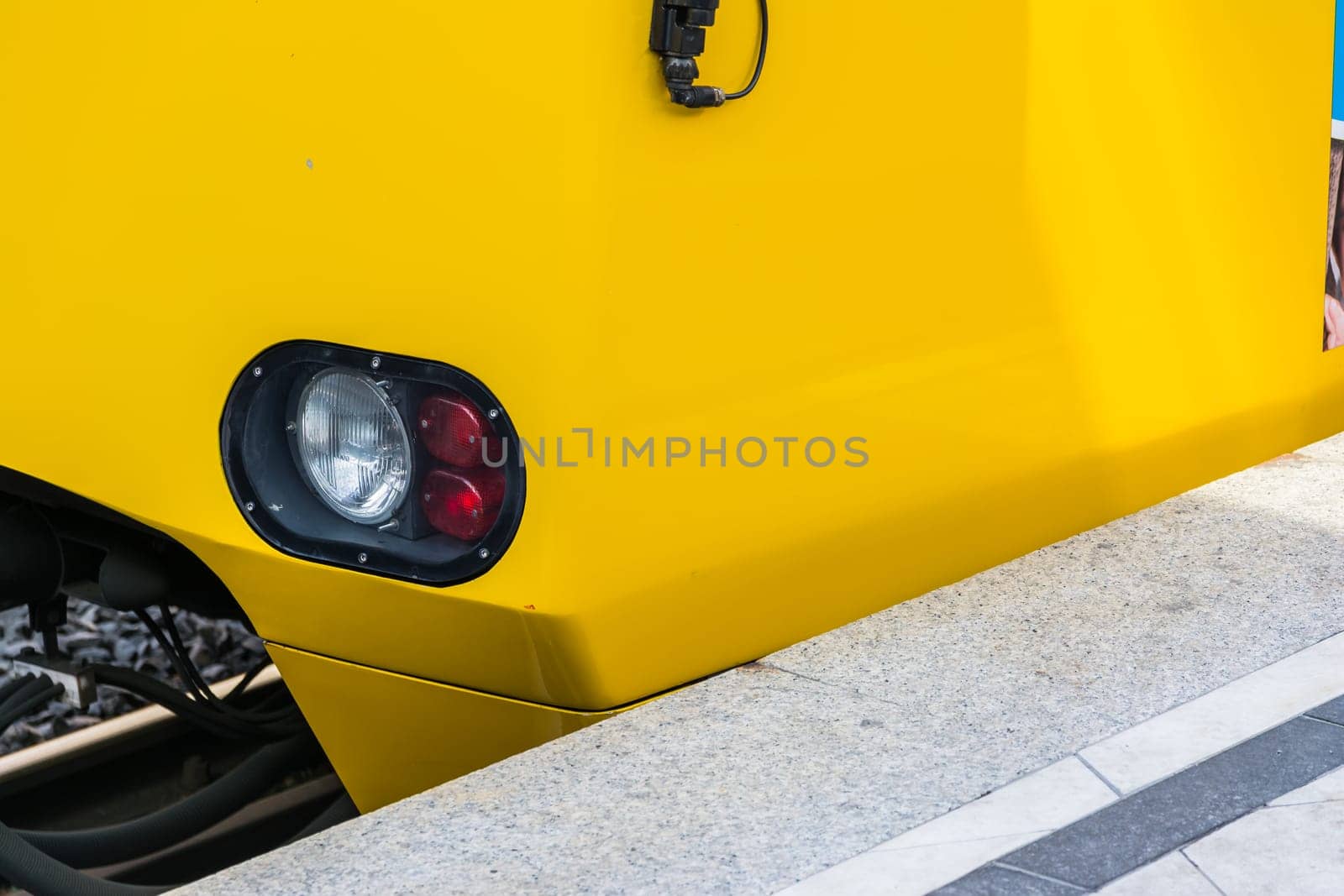 Subway Train Headlight Arriving Red White Light Daytime Yellow Side Abstract Bright Concrete Platform Closeup Detail Copyspace