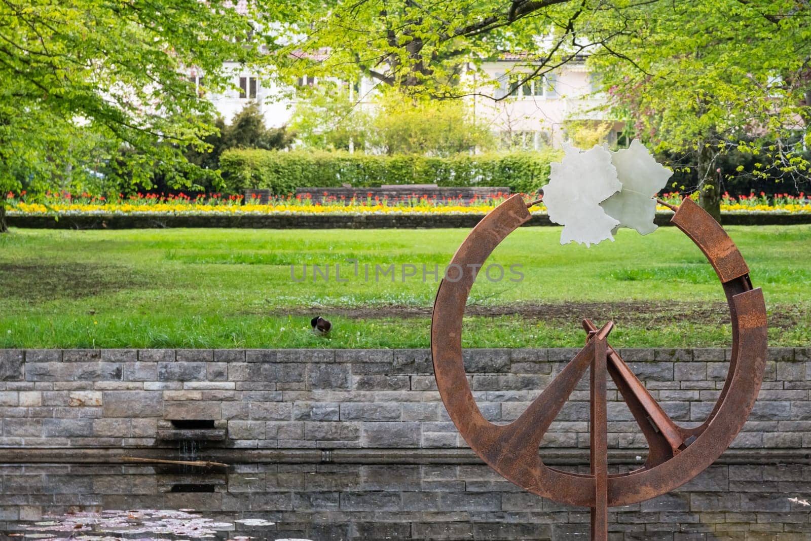 Germany Country Shape Statue Art Decoration in Spring Park Green Grass Water Reflection