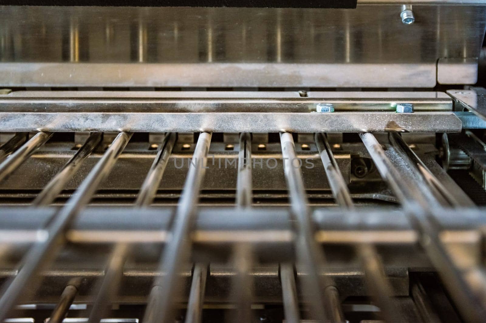 Paper Folding Machine Fold Unit Inside Metal Bars Press Closeup Inner Workings Print Production Book Signature Slot