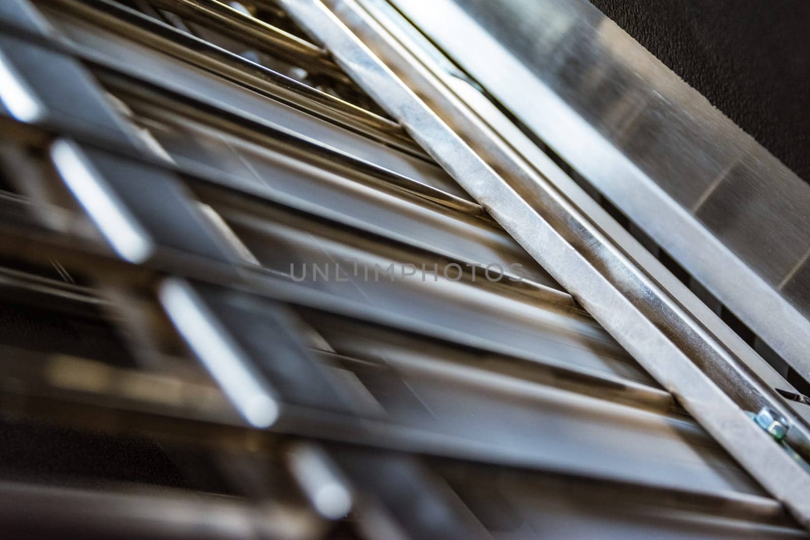 Paper Folding Machine Fold Unit Inside Metal Bars Press Closeup Inner Workings Print Production Book Signature Slot