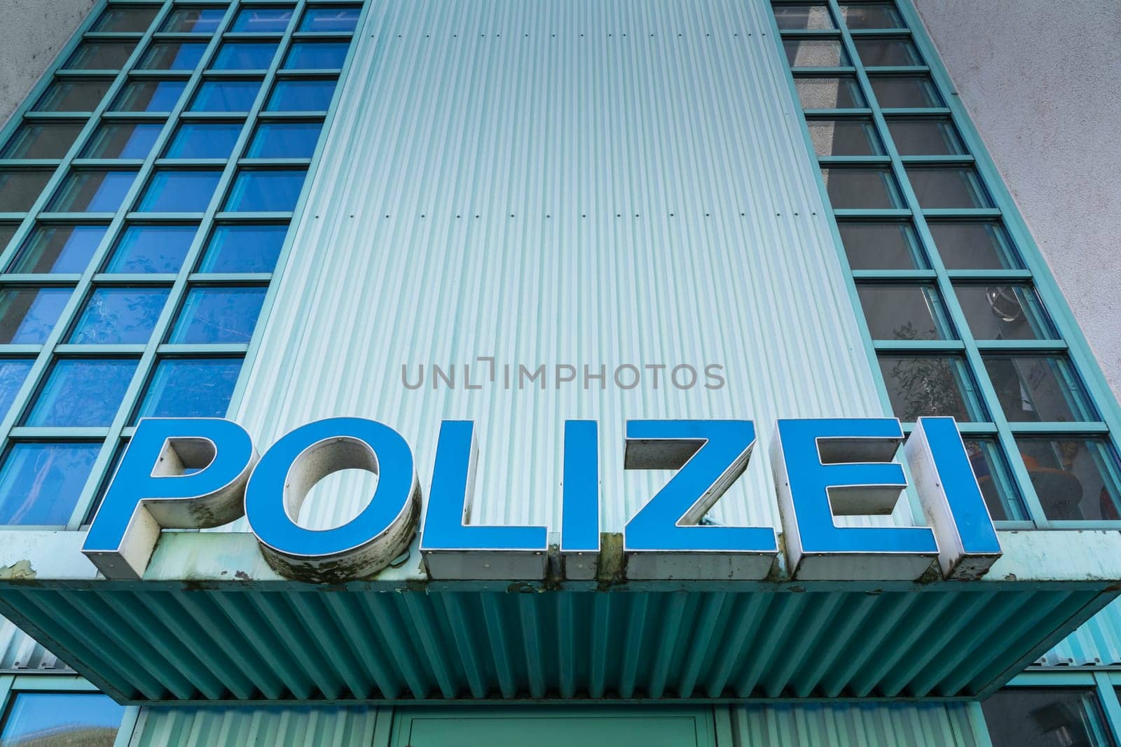 Polizei Police Sign Station Front Entrance Authority Blue Shield Title Large Letters Doors Closeup