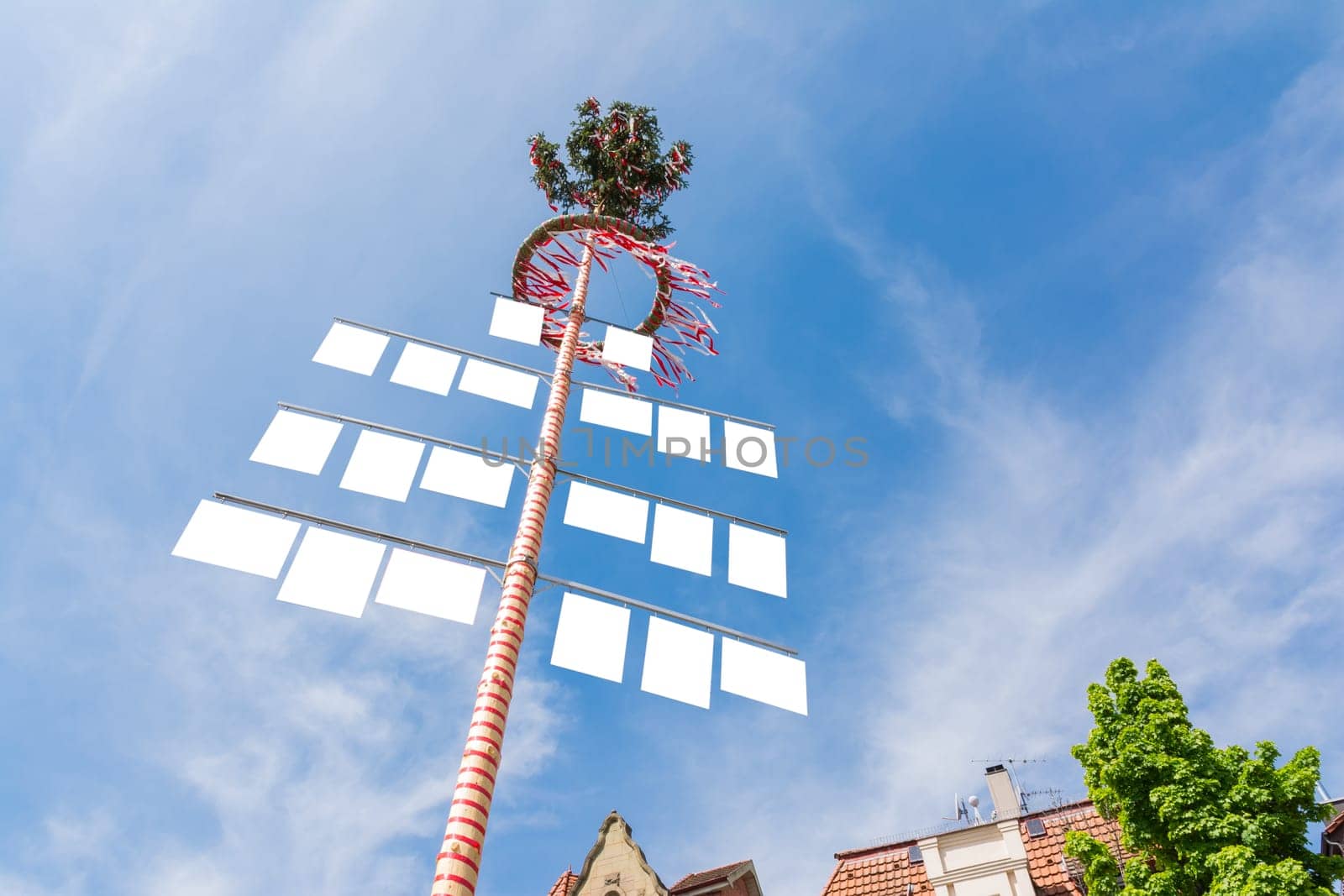 Blank White Signs on Traditional German May Pole Maibaum Blue Skies Local Tradition