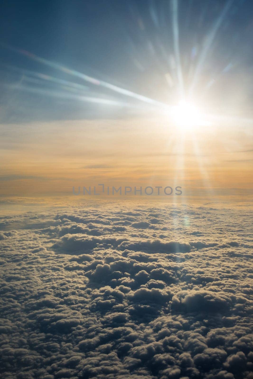 A Close-up of Clouds and Sun Photo Taken on the Airplane