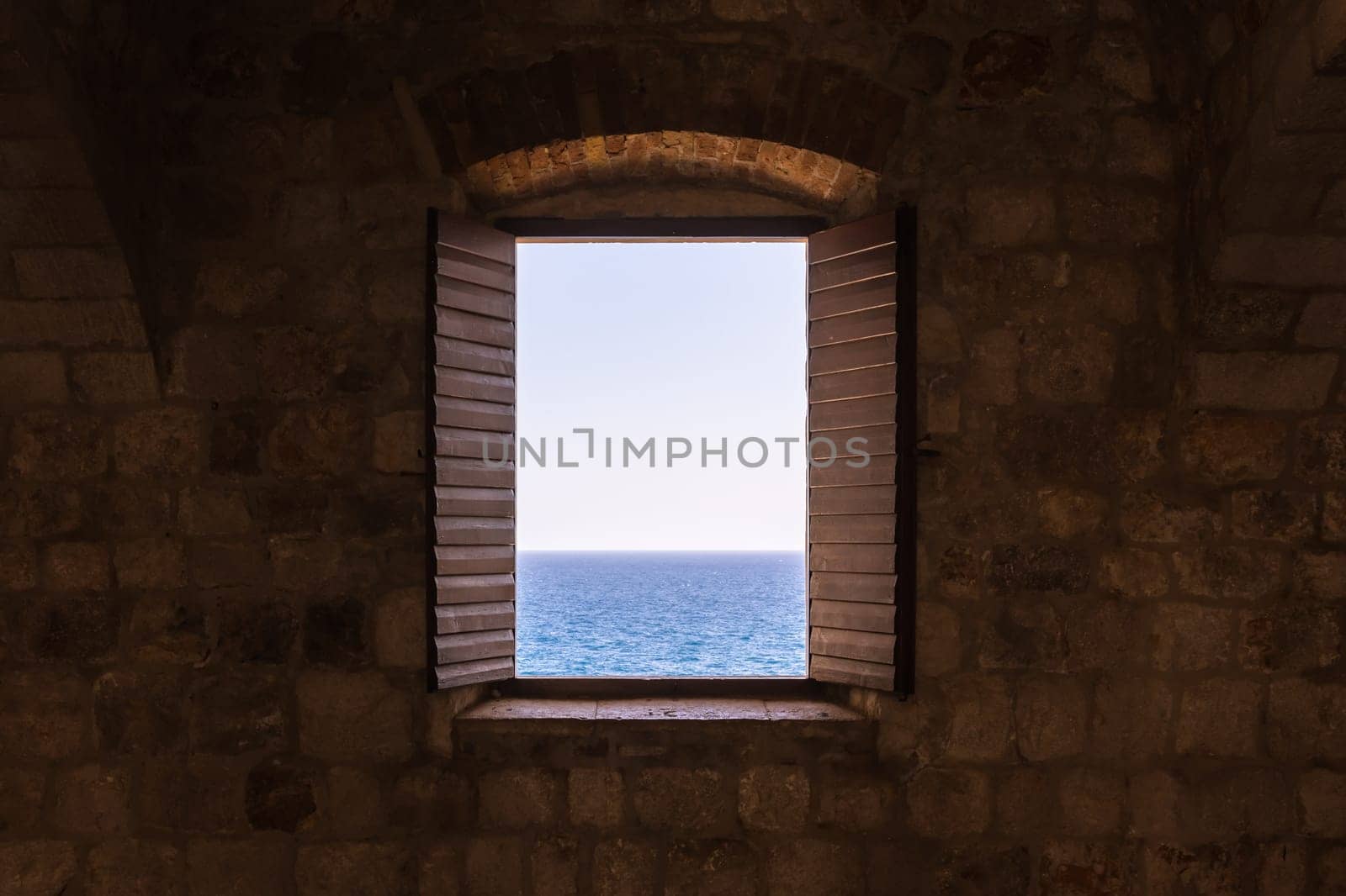 Old Vintage Window Open Shutters Looking Out at Ocean Castle Fortress Interior Perspective