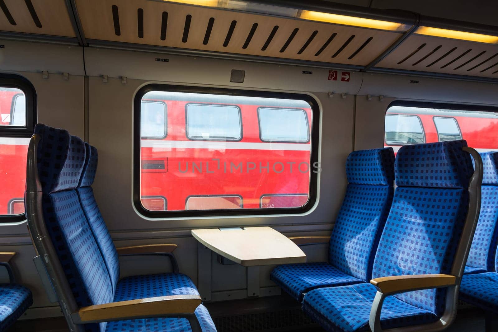 Modern Train Wagon Interior Seats Rows Blue Transportation White Daytime Traveling Empty