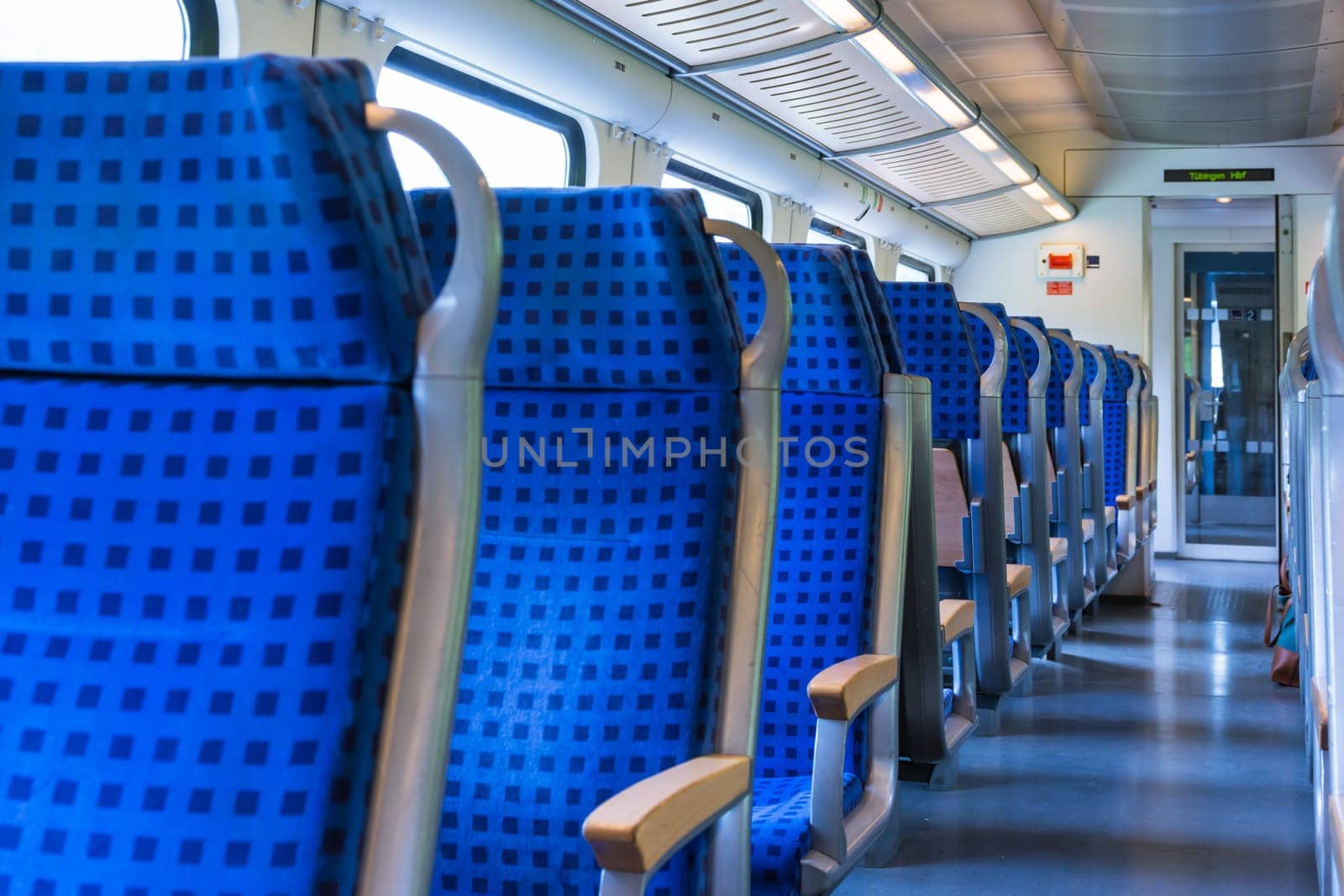 Modern Train Wagon Interior Seats Rows Blue Transportation White Daytime Traveling Empty