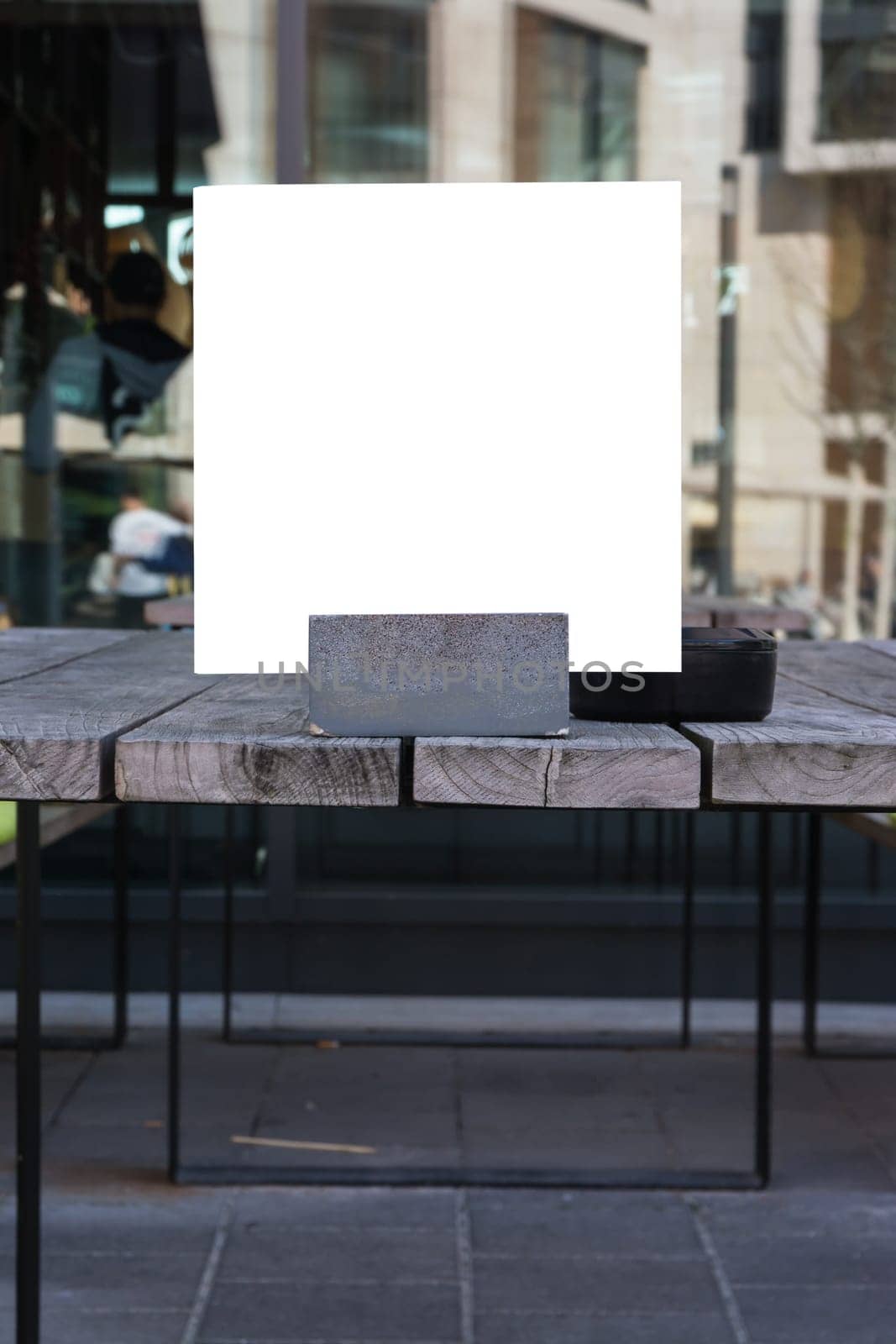 Blank Restaurant Menu Card in Holder Wooden Table Closeup Template White Space