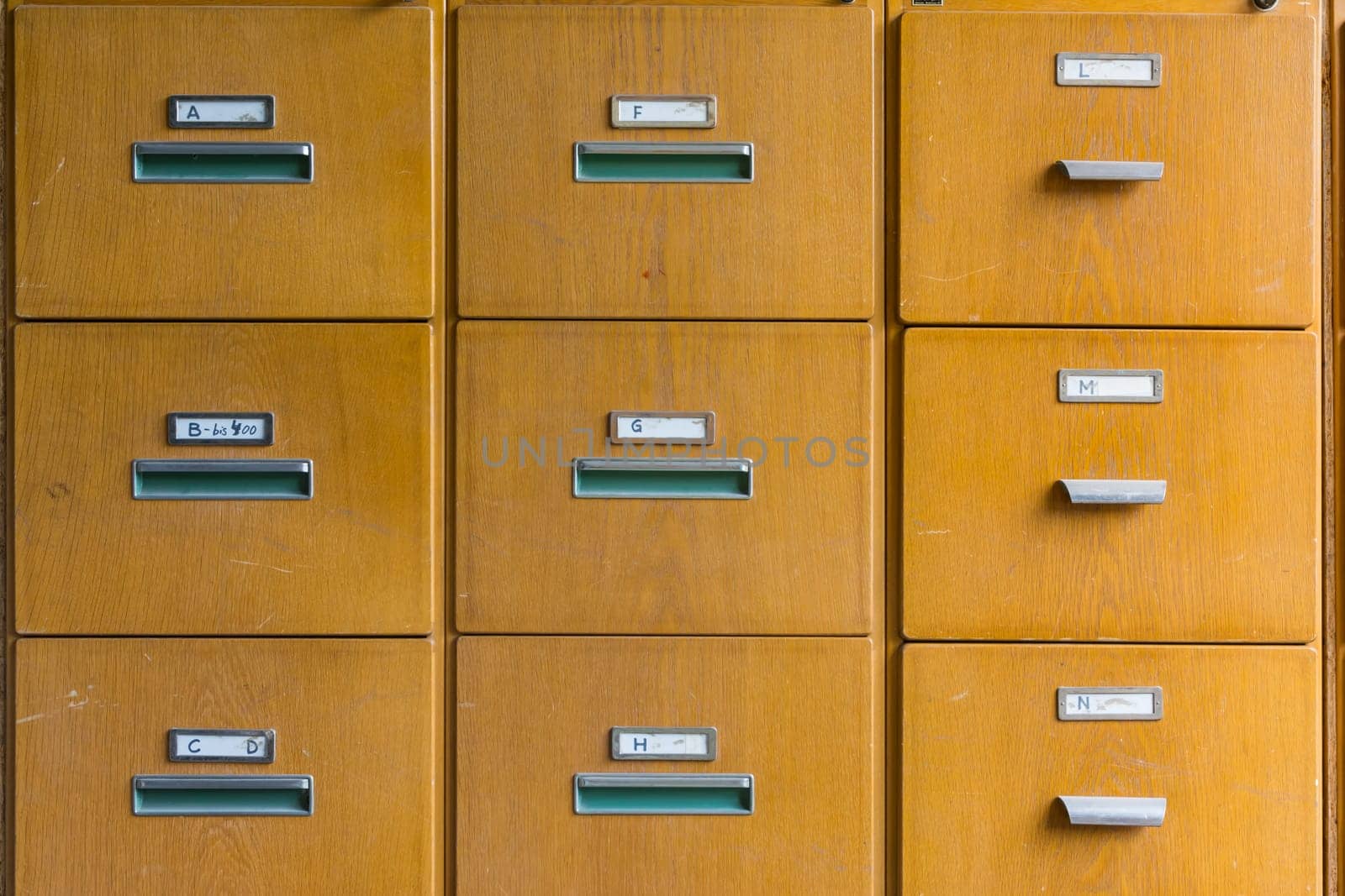Wooden File Cabinet Straight On Geometric Pattern Squares Empty Labels Doors Closed Old Vintage Brown Office Supply