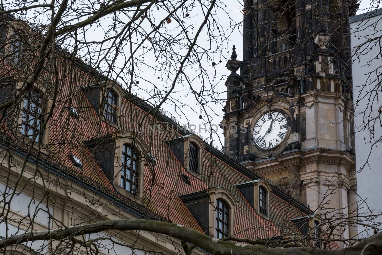 Clocktower Closeup Church White Roman Numerals Stone Architecture Religion Winter Cold Day Tree Branches