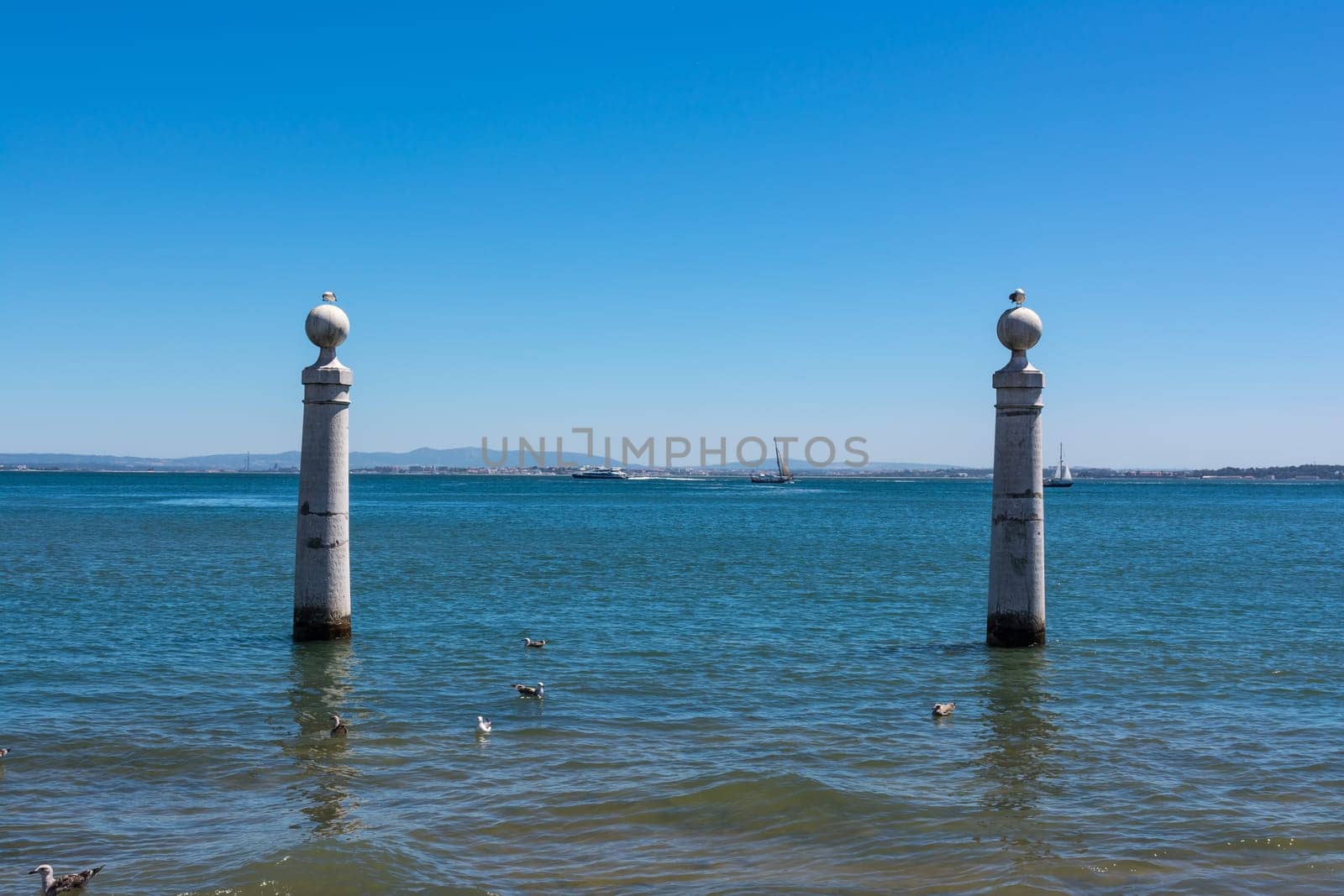 View of Ocean from Shore of Comercio Square in Lisbon Portugal Landscape Daytime View