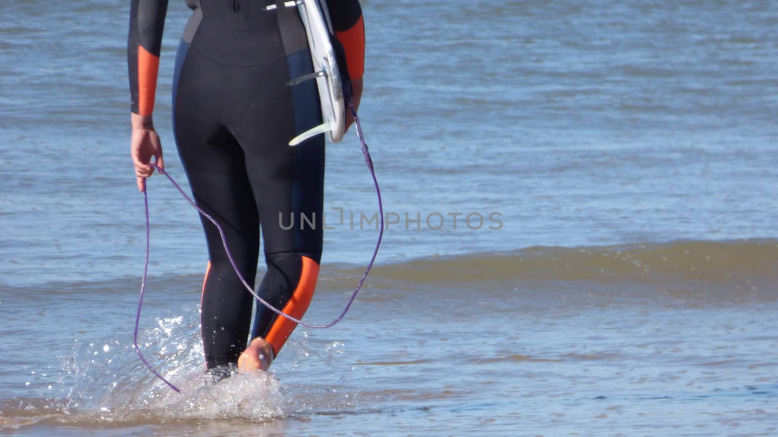 Surfer Legs Walking on Becah Holding Surfboard Ocean