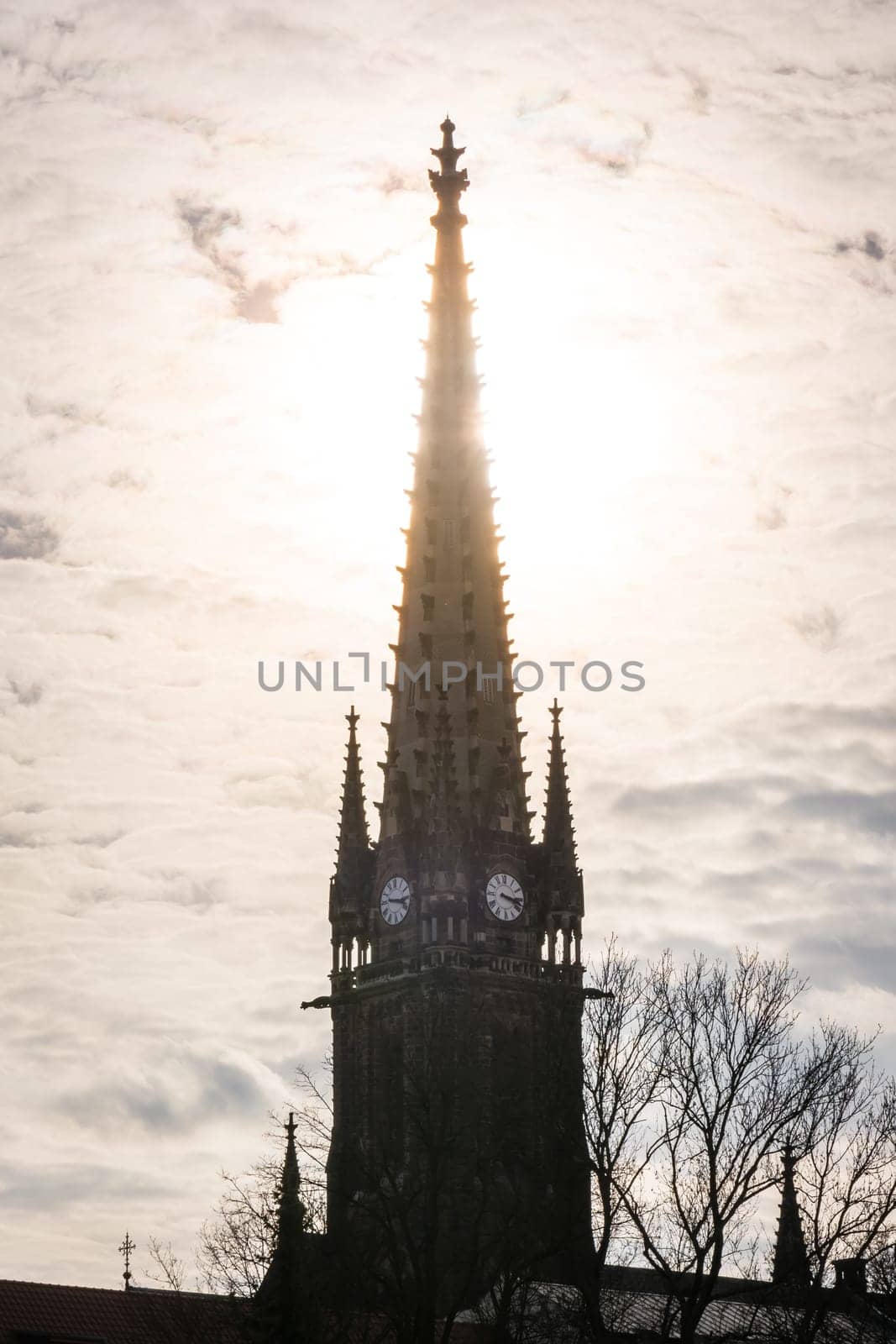 Sunset Behind Clock Tower Spire Silhouette Architecture Point Clouds Bright Flare