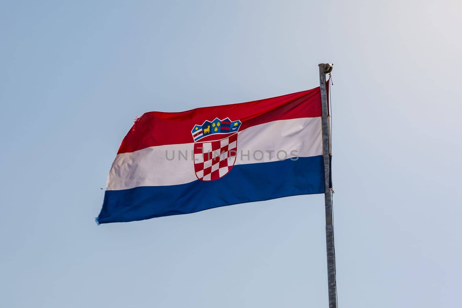 Croatian Flag on Blue Sky Background Bright Sunny Day Closeup Detail