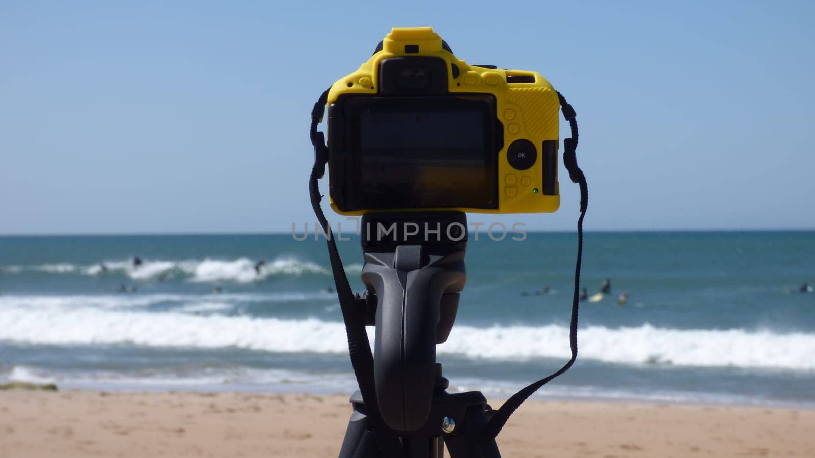 Camera Setup on Tripod Taking Pictures of Beach