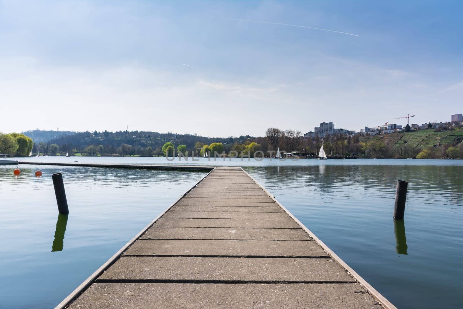 Concrete Dock Perspective Out onto Lake Outdoors Autumn Daytime Landscape