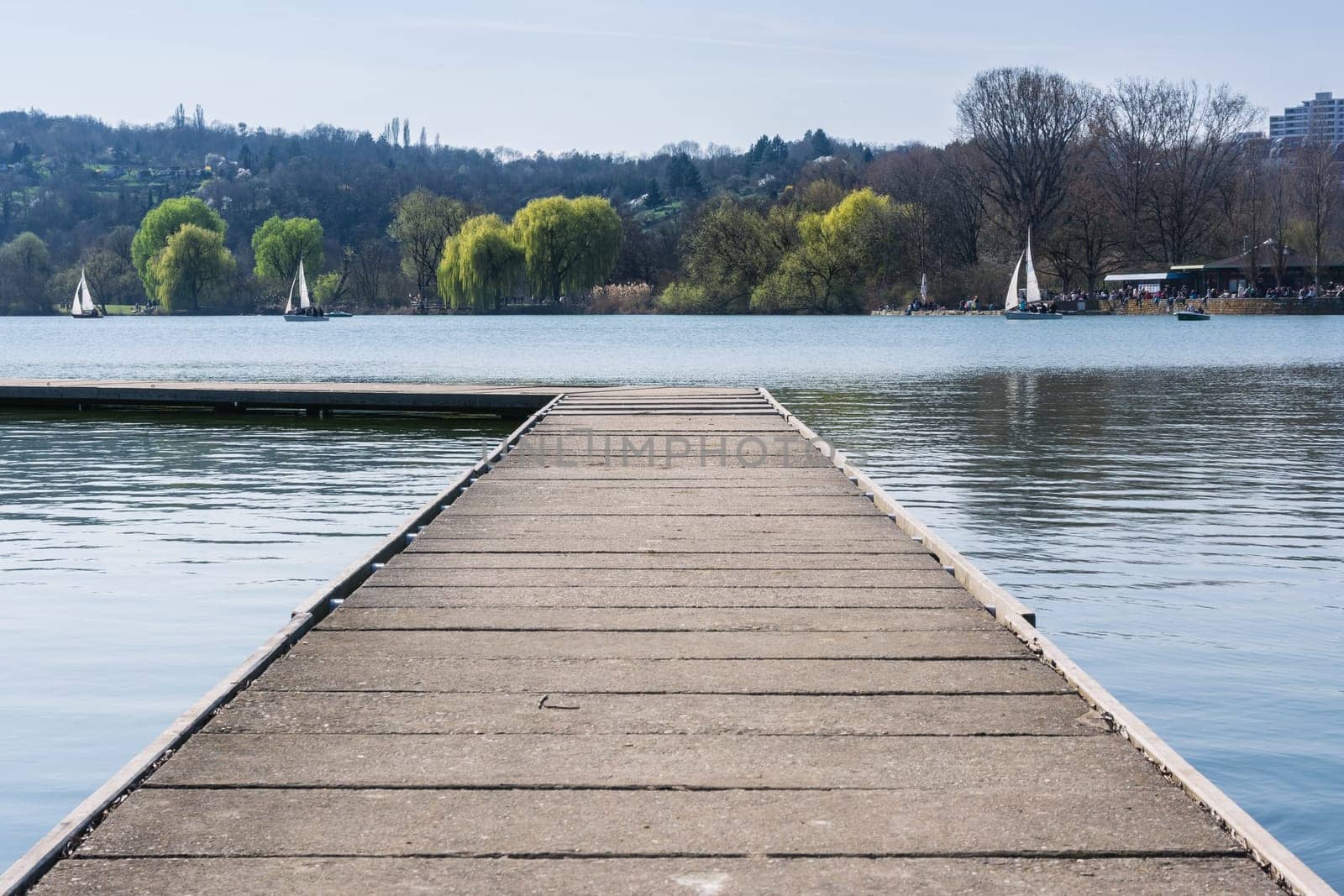 Concrete Dock Perspective Out onto Lake Outdoors Autumn Daytime Landscape