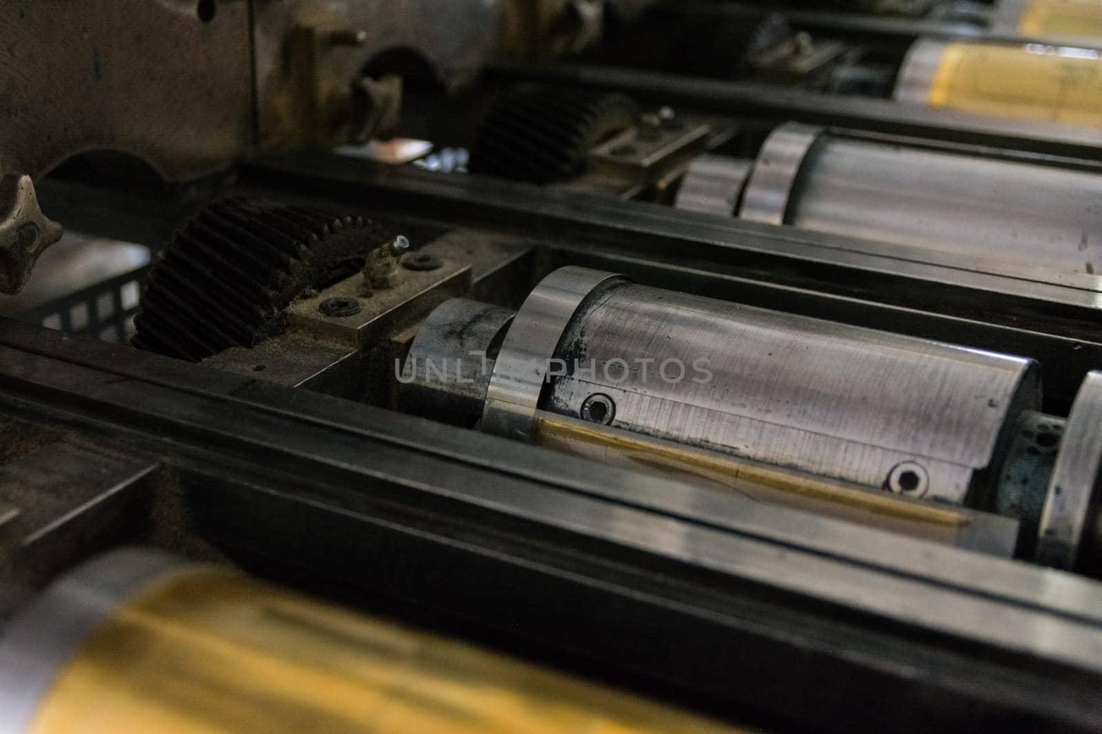 Golden Letterpress Cylinders Rustic Vintage Printing Method Metallic Rollers Four Color CMYK Print Closeup Machine Industrial Equipment