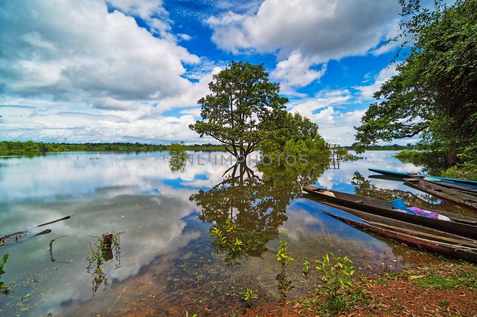 Landscape with standing water and reflection of clouds
