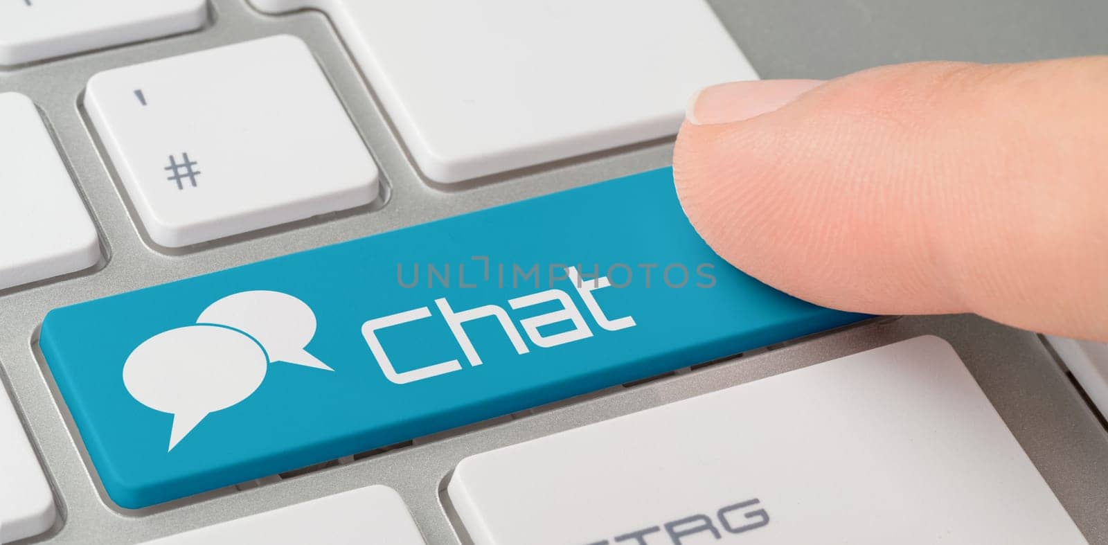 A keyboard with a blue labeled button - Chat