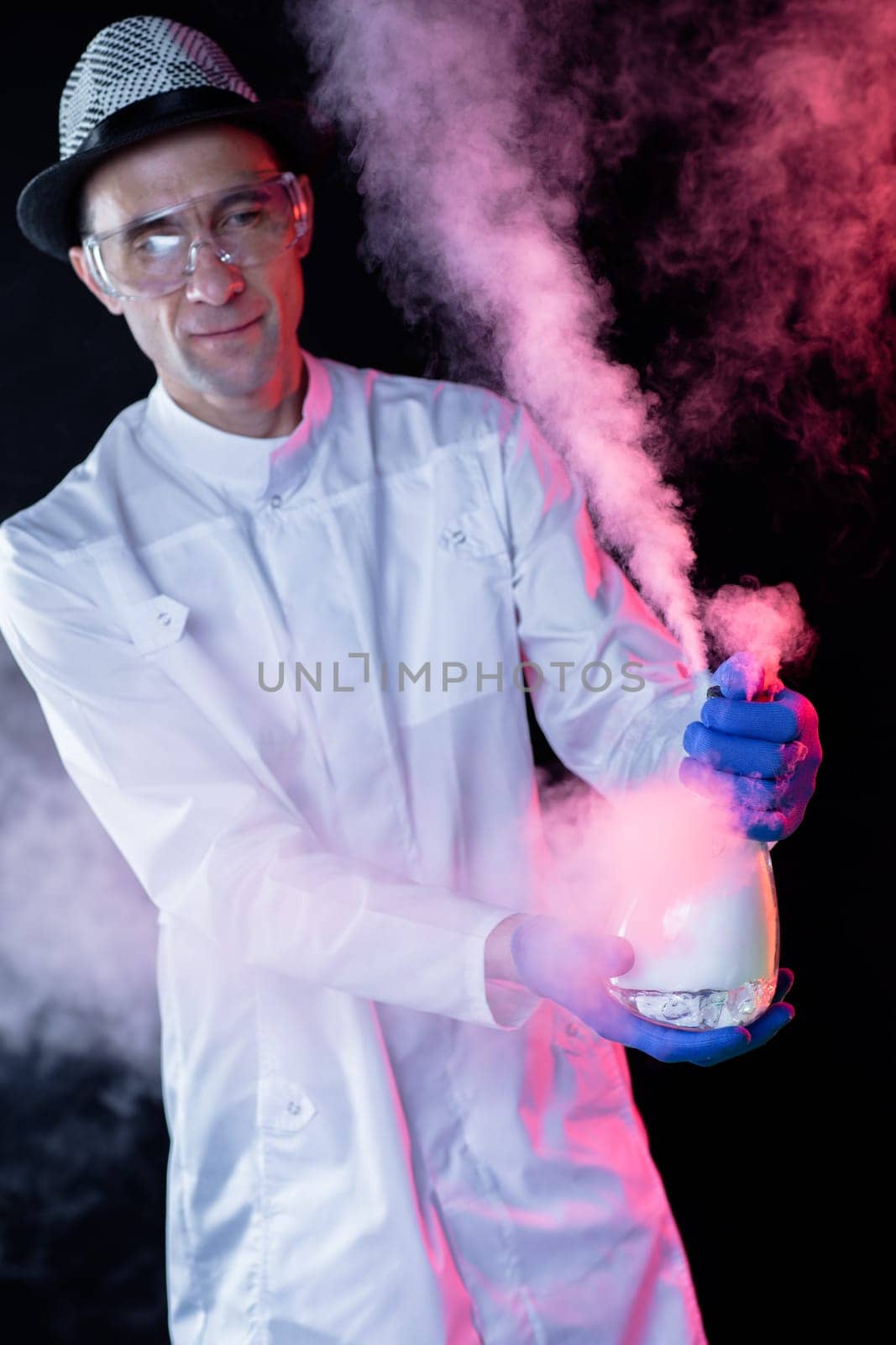 Smiling man scientist with dry ice
