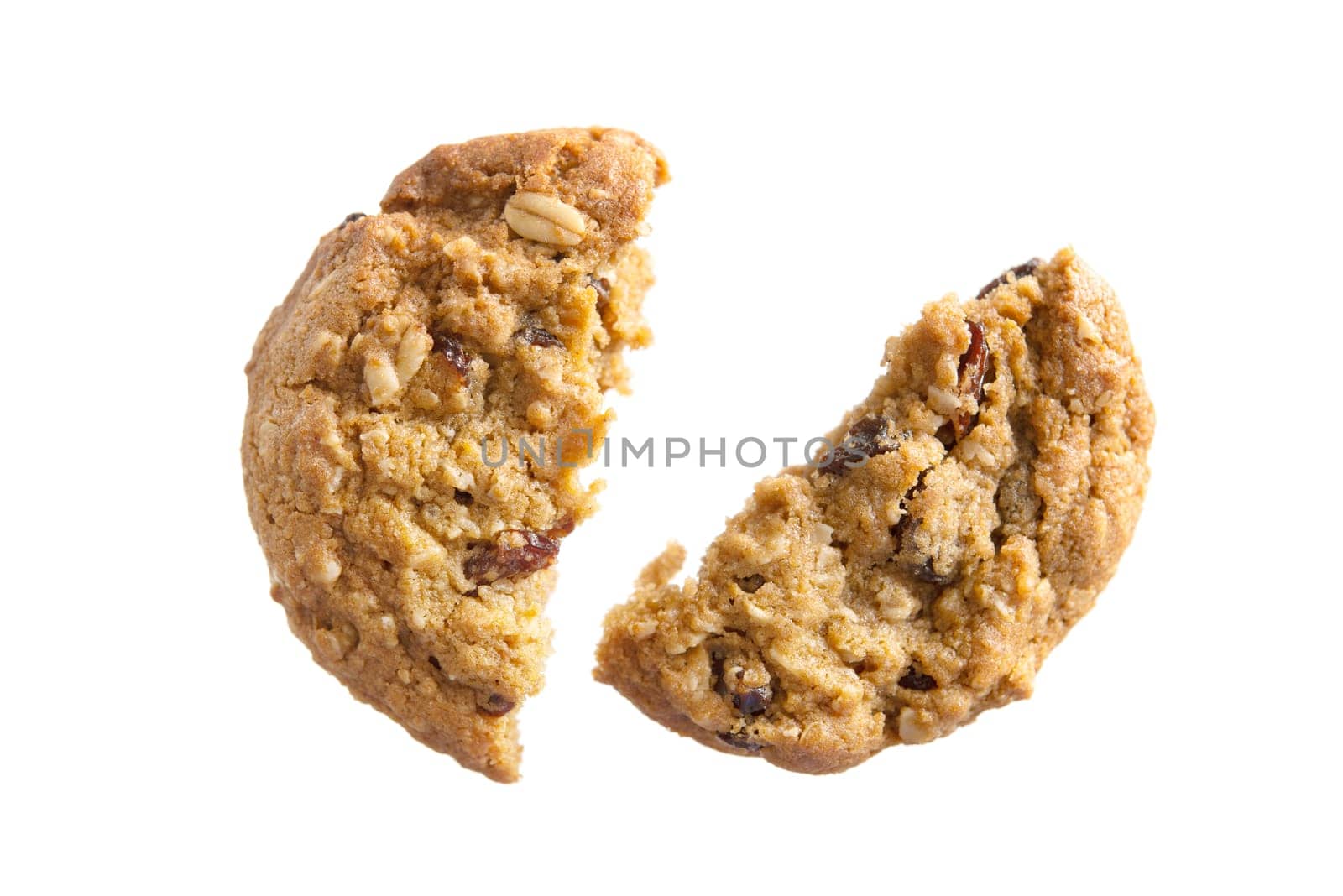 Delicious oatmeal raisin cookies with chocolate broken isolated on white background
